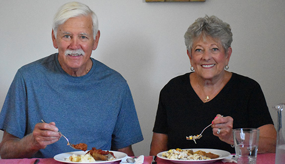 Meals On Wheels Seniors Eating Meal